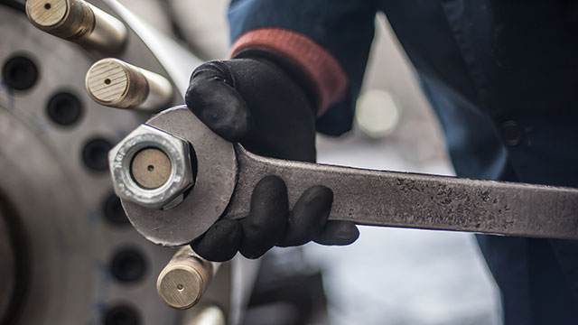 heavy-mechanic-holding-wrench-screws-large-nut