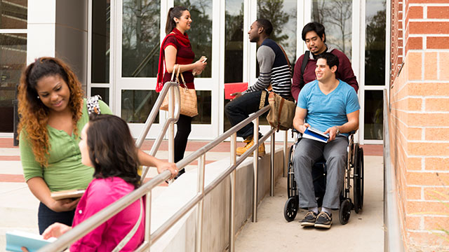 people on steps and wheelchair ramp access ada compliant